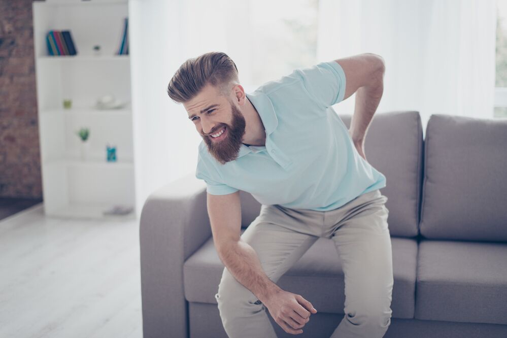 Acute lower back pain with sharp movements in a patient with osteochondrosis